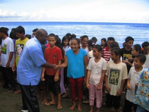 Pastor Mike congratulating newly baptized