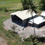 Hangar with houses on either side