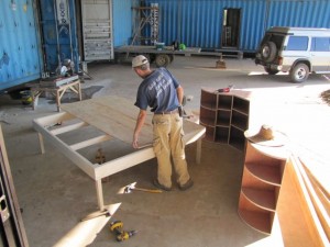 Andriy making kitchen cabinets and bed for hangar apartment