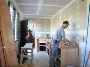 Dwayne and Wendy work in the kitchen and bathroom