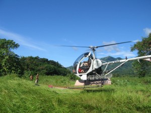 Flying plywood into the mountains for a new clinic (in the old helicopter)