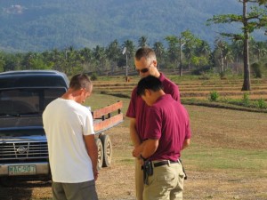 Praying pilots (Sean, Daniel, and Dwayne)